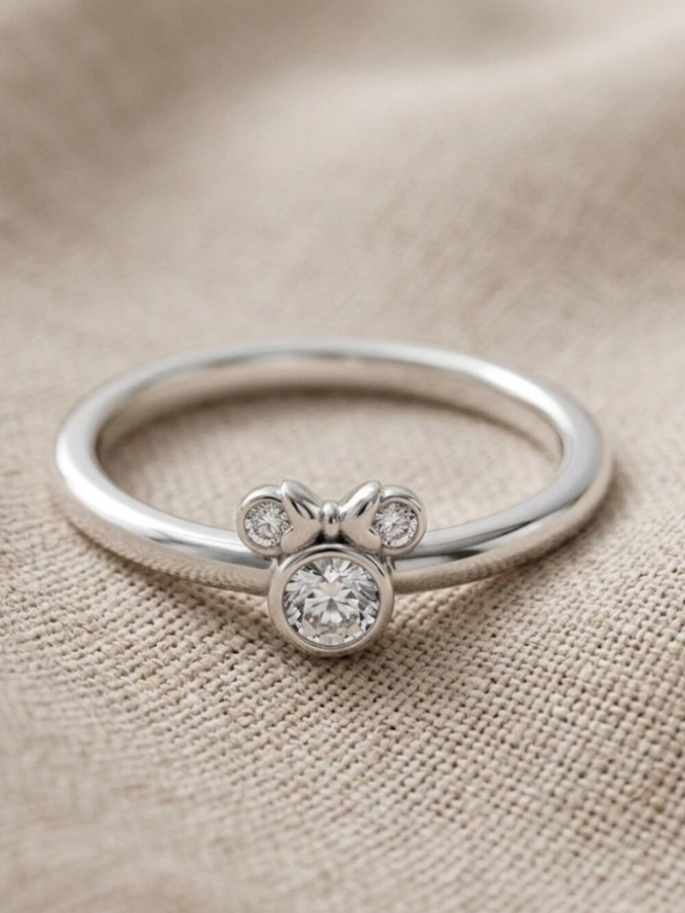 Delicate Silver Bow Accent Ring with Sparkling Stones - Women's Jewelry